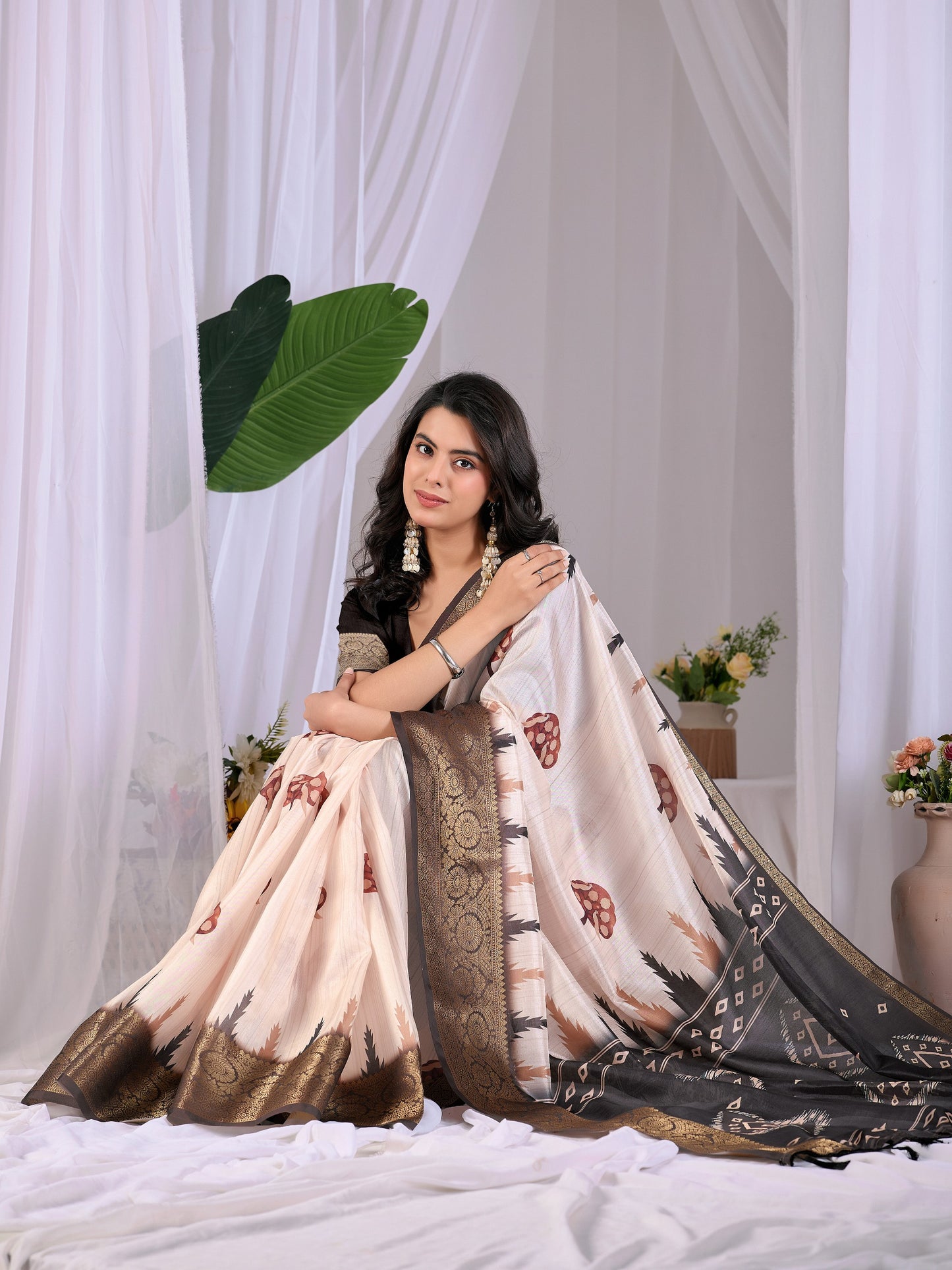 Soft Lichi Silk Saree with elegant traditional motifs in subtle cream and black shades with a woven border of saree