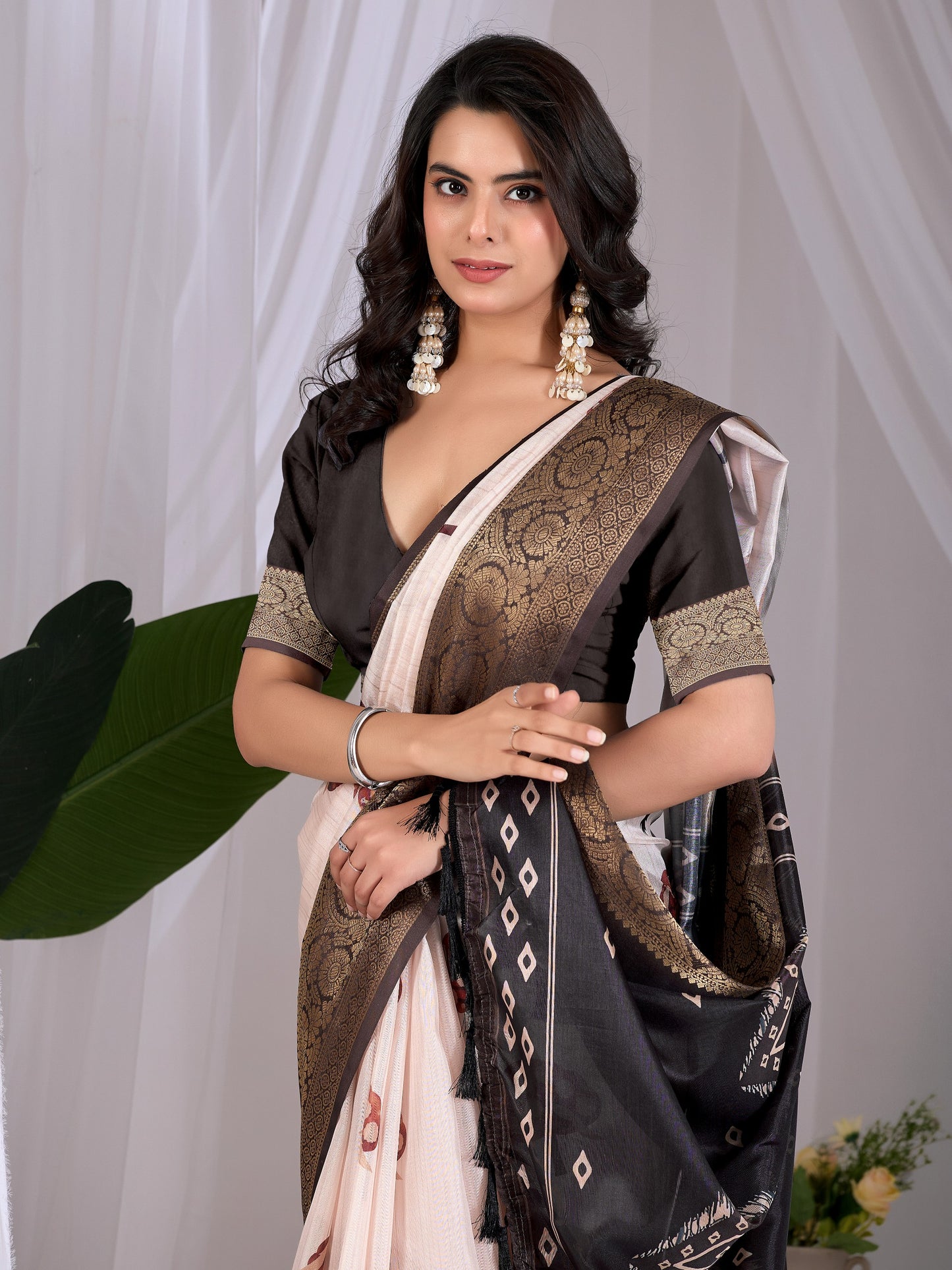Soft Lichi Silk Saree with elegant traditional motifs in subtle cream and black shades with a woven border of saree