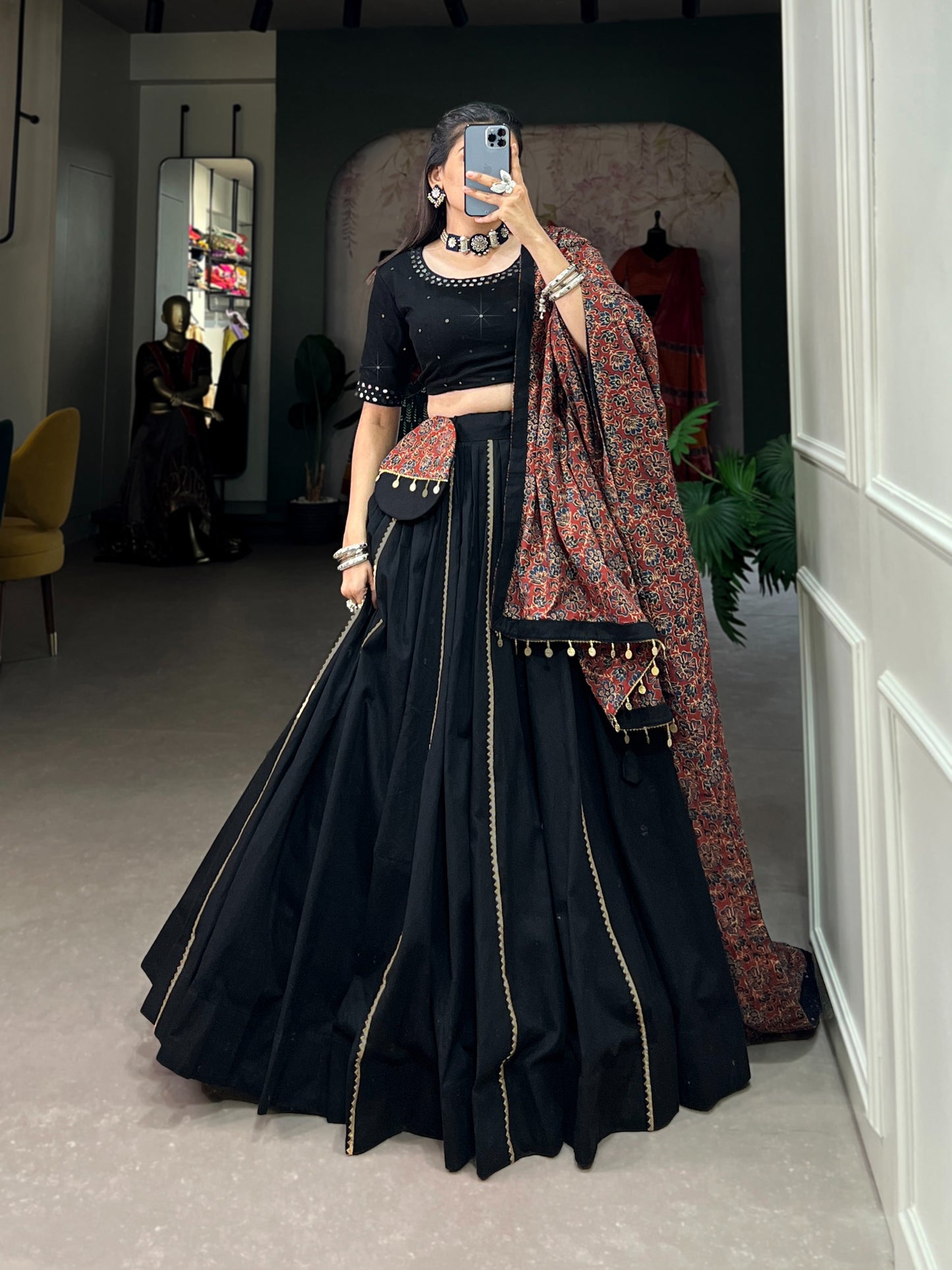 Dance through Navratri nights in this beautifully printed pure cotton lehenga choli. Complete with a matching purse and intricate coin lace detailing, it's perfect for the celebrations! 🥰