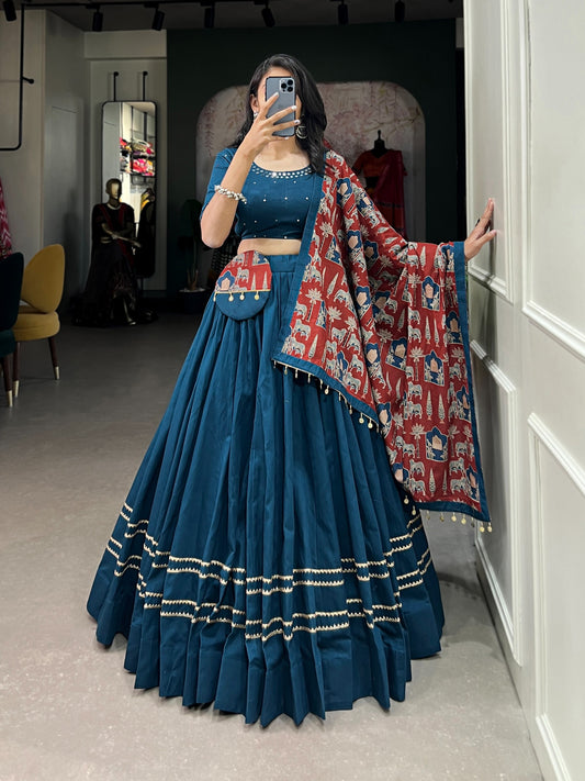 Dance through Navratri nights in this beautifully printed pure cotton lehenga choli. Complete with a matching purse and intricate coin lace detailing, it's perfect for the celebrations! 🥰