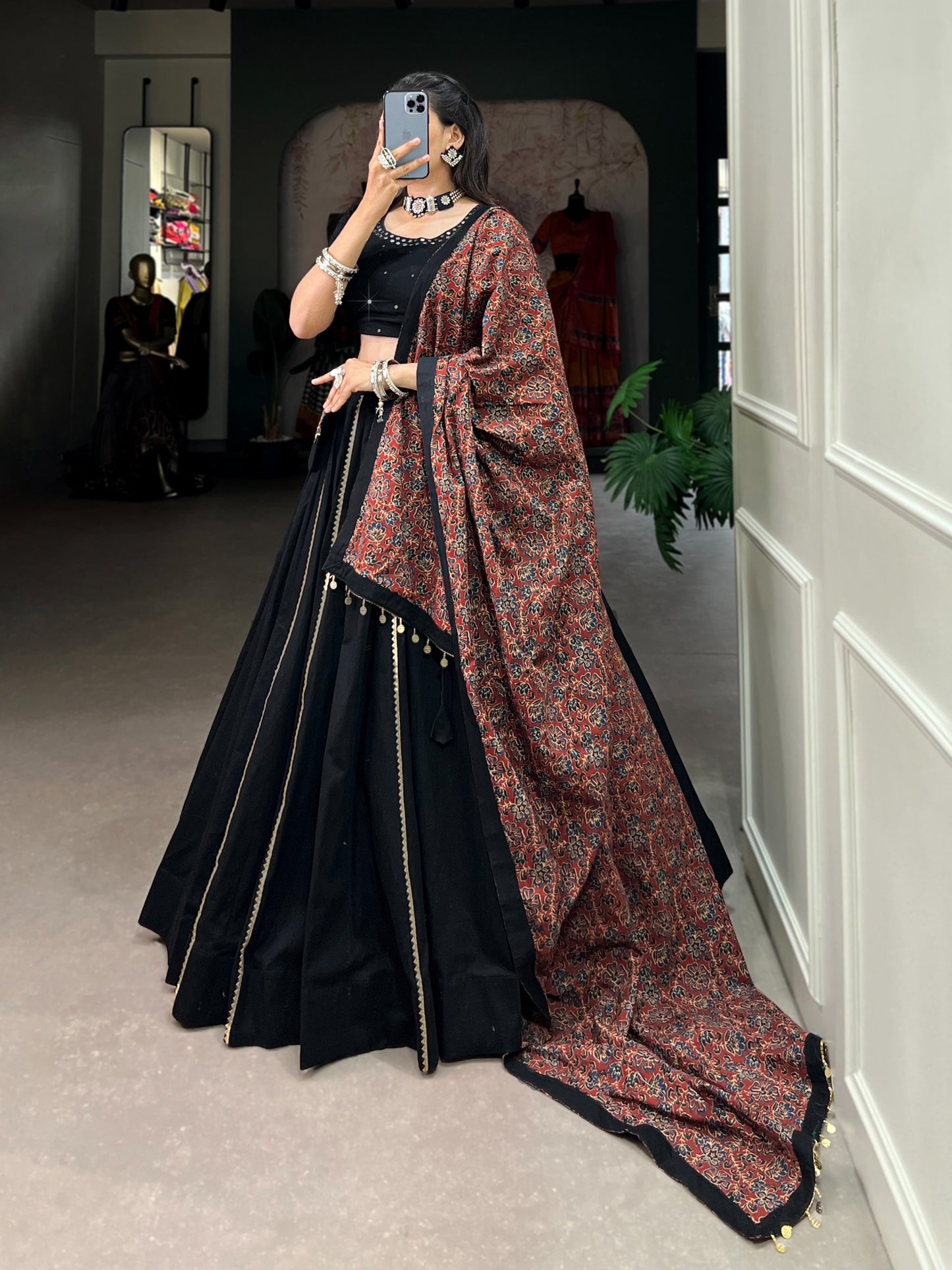 Dance through Navratri nights in this beautifully printed pure cotton lehenga choli. Complete with a matching purse and intricate coin lace detailing, it's perfect for the celebrations! 🥰