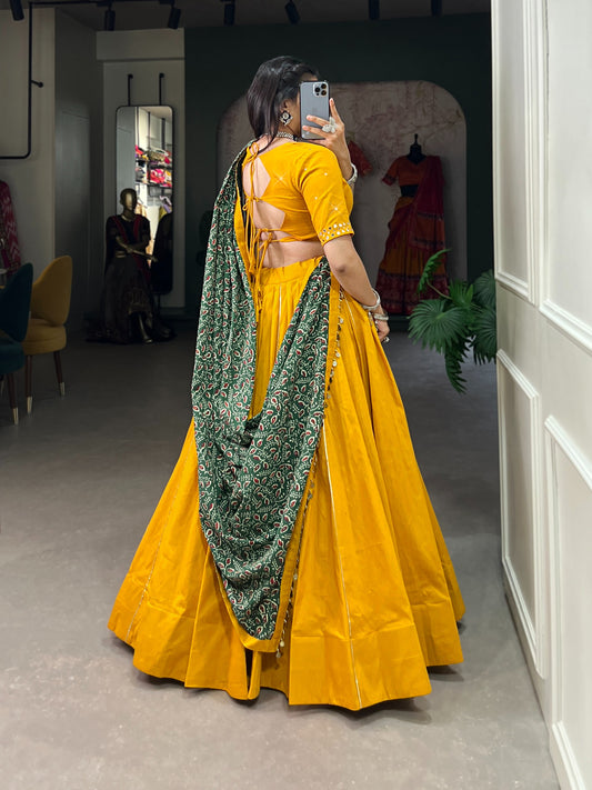 Dance through Navratri nights in this beautifully printed pure cotton lehenga choli. Complete with a matching purse and intricate coin lace detailing, it's perfect for the celebrations! 🥰