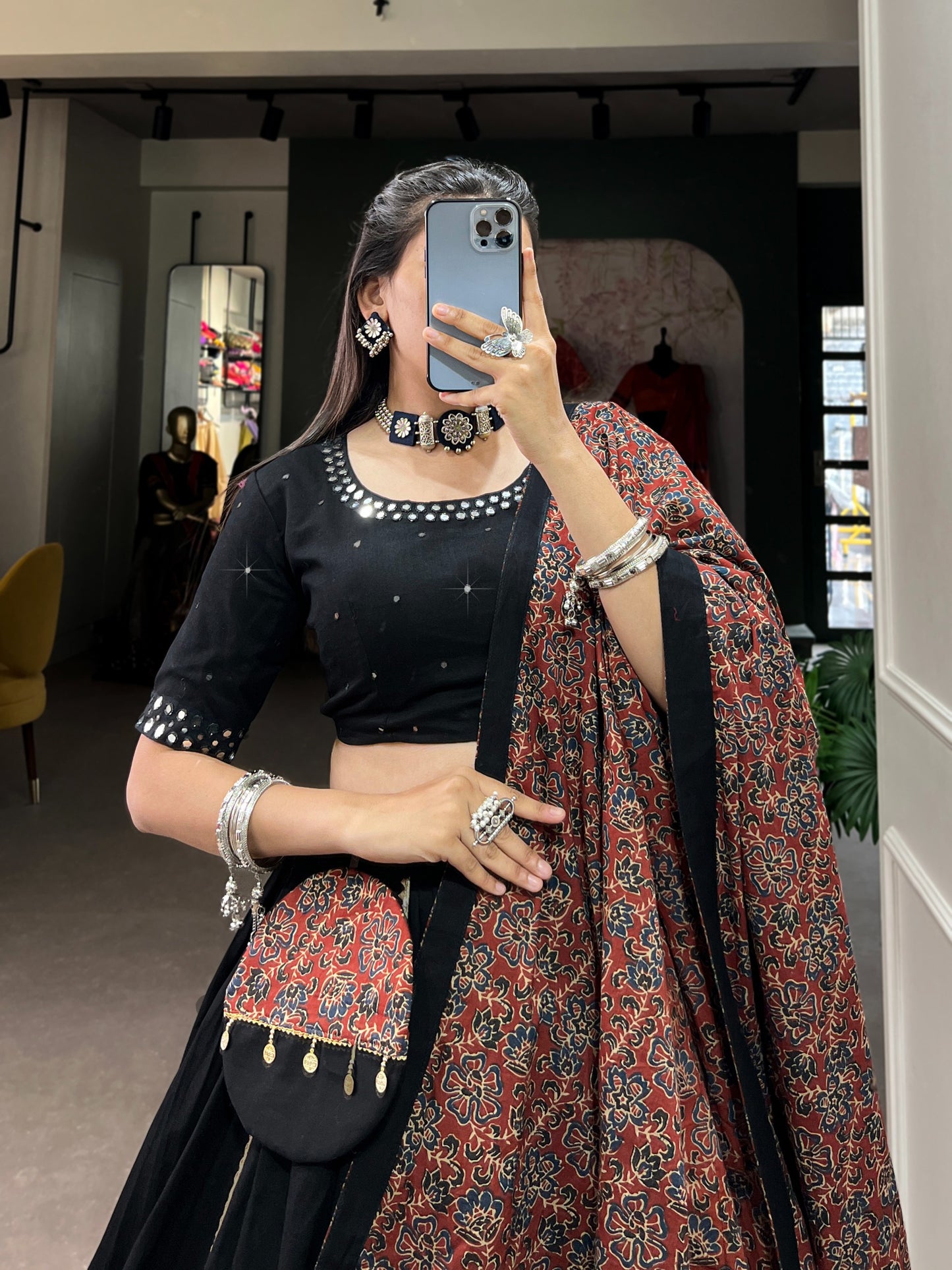 Dance through Navratri nights in this beautifully printed pure cotton lehenga choli. Complete with a matching purse and intricate coin lace detailing, it's perfect for the celebrations! 🥰