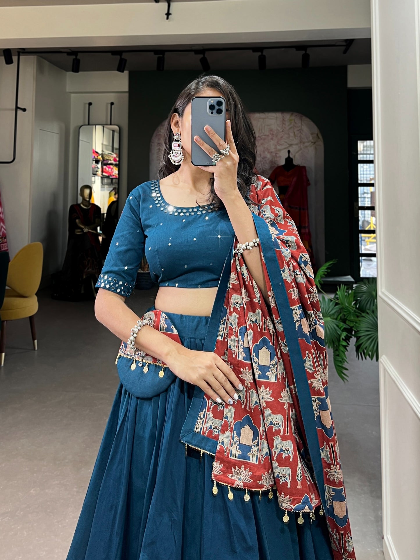 Dance through Navratri nights in this beautifully printed pure cotton lehenga choli. Complete with a matching purse and intricate coin lace detailing, it's perfect for the celebrations! 🥰