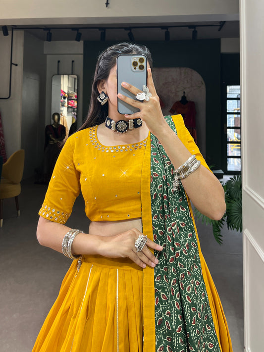 Dance through Navratri nights in this beautifully printed pure cotton lehenga choli. Complete with a matching purse and intricate coin lace detailing, it's perfect for the celebrations! 🥰