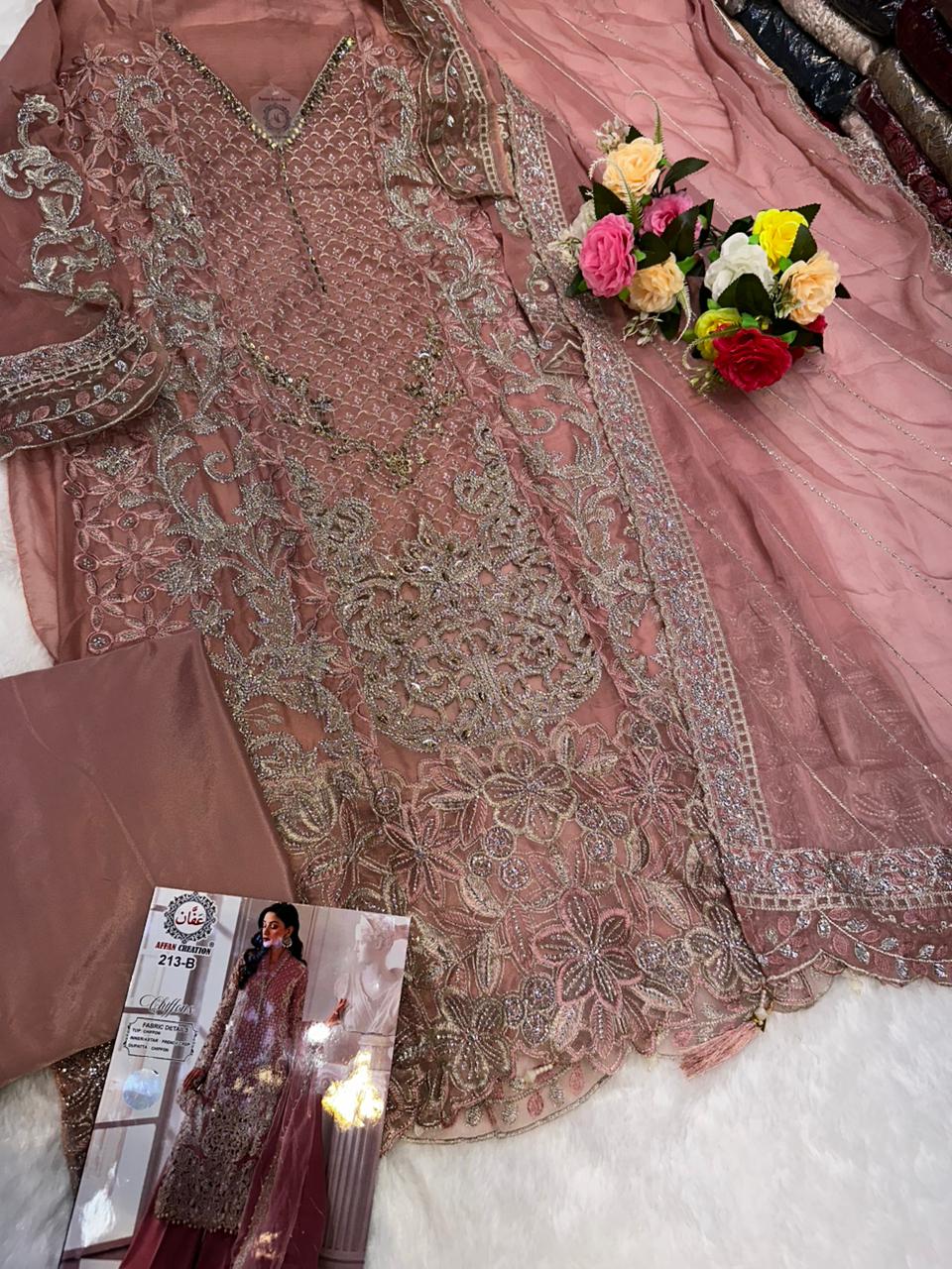 Women's Semi-Stitched Chiffon Pakistani Suit Catalog Set in Assorted Colors with Heavy Embroidery and Laser Cutwork